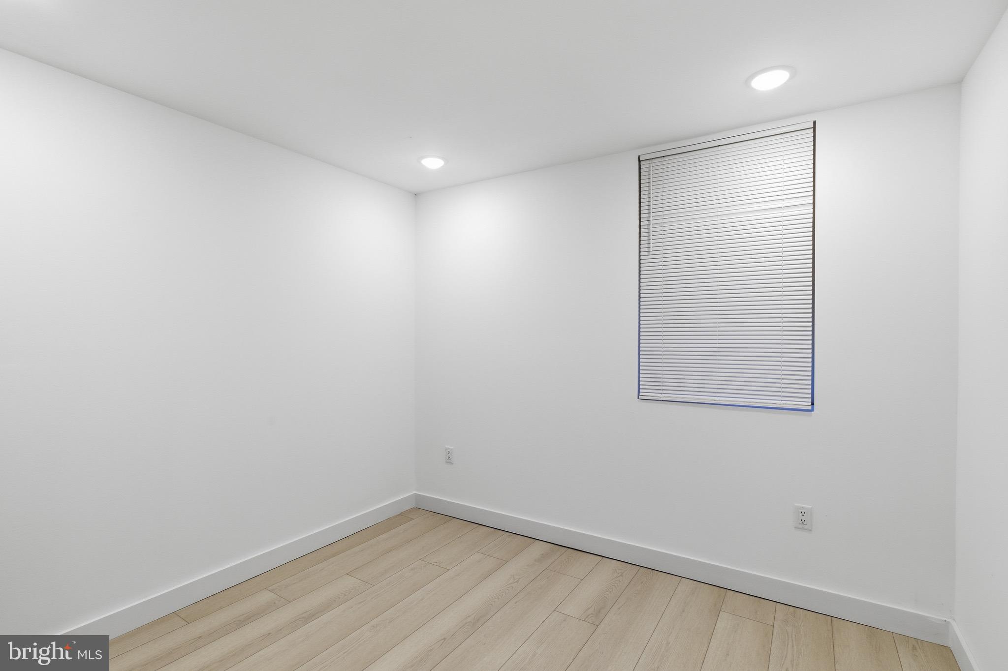 1005 West Orleans Street Philadelphia, PA 19133 - Photo 11 of 25 a view of a small space with wooden floor and a window