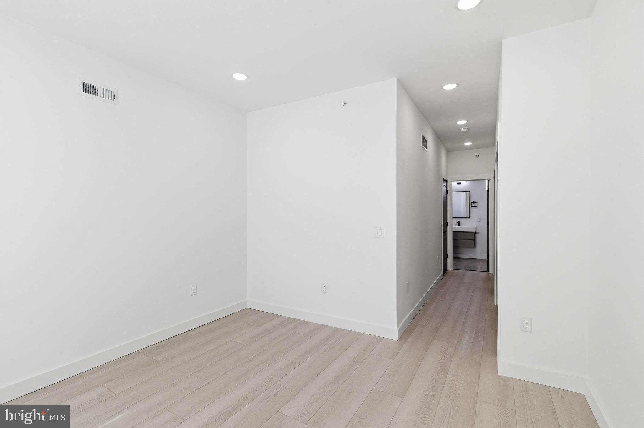 1005 West Orleans Street Philadelphia, PA 19133 - Photo 13 of 25 a view of a hallway with wooden floor