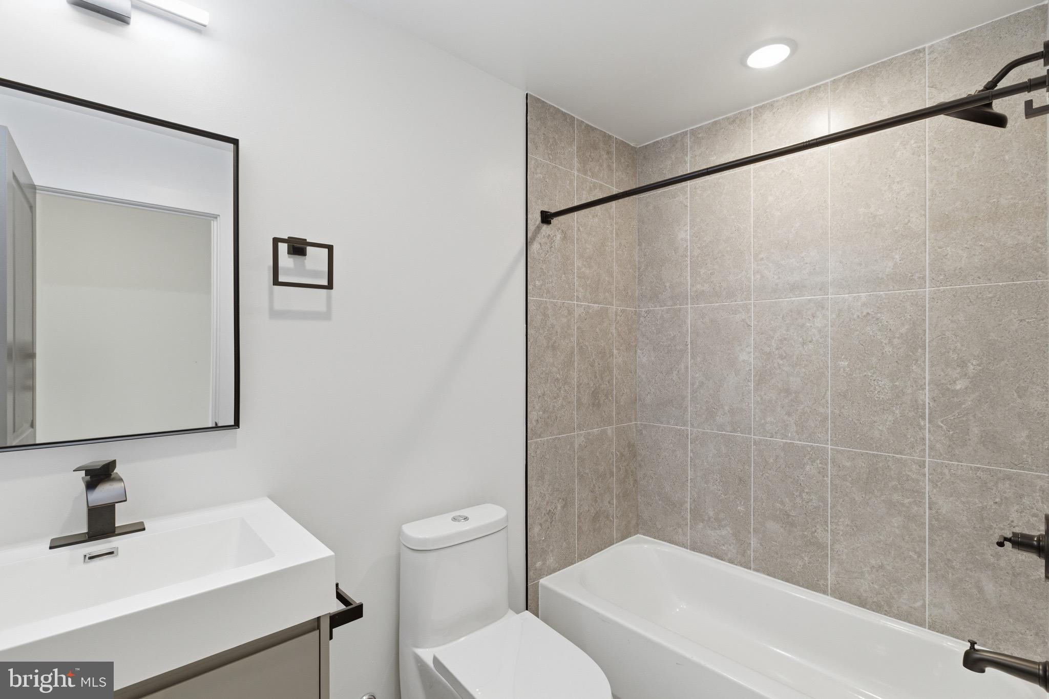 1005 West Orleans Street Philadelphia, PA 19133 - Photo 18 of 25 a bathroom with a sink toilet and shower