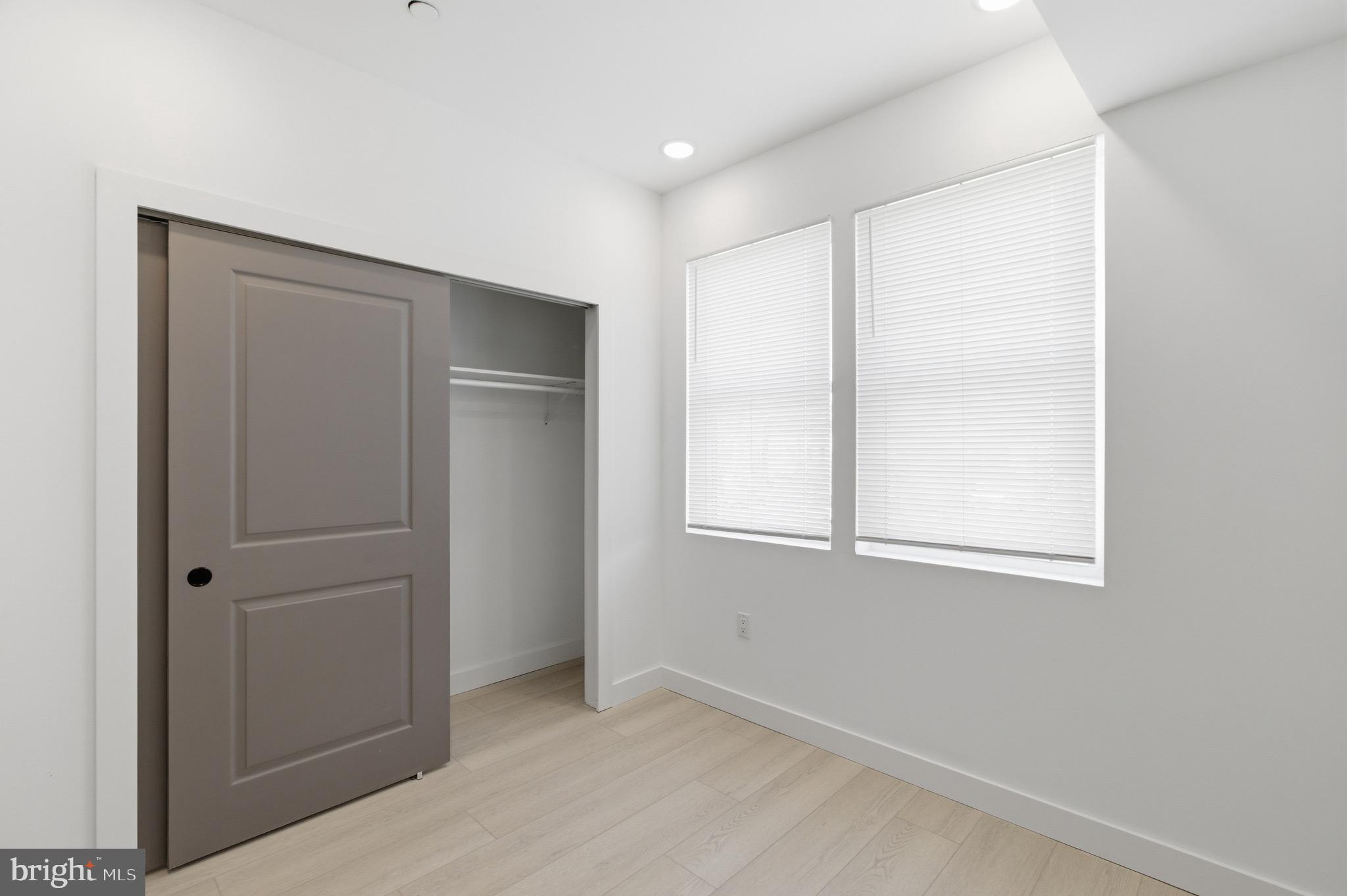 1005 West Orleans Street Philadelphia, PA 19133 - Photo 19 of 25 an empty room with windows and closet
