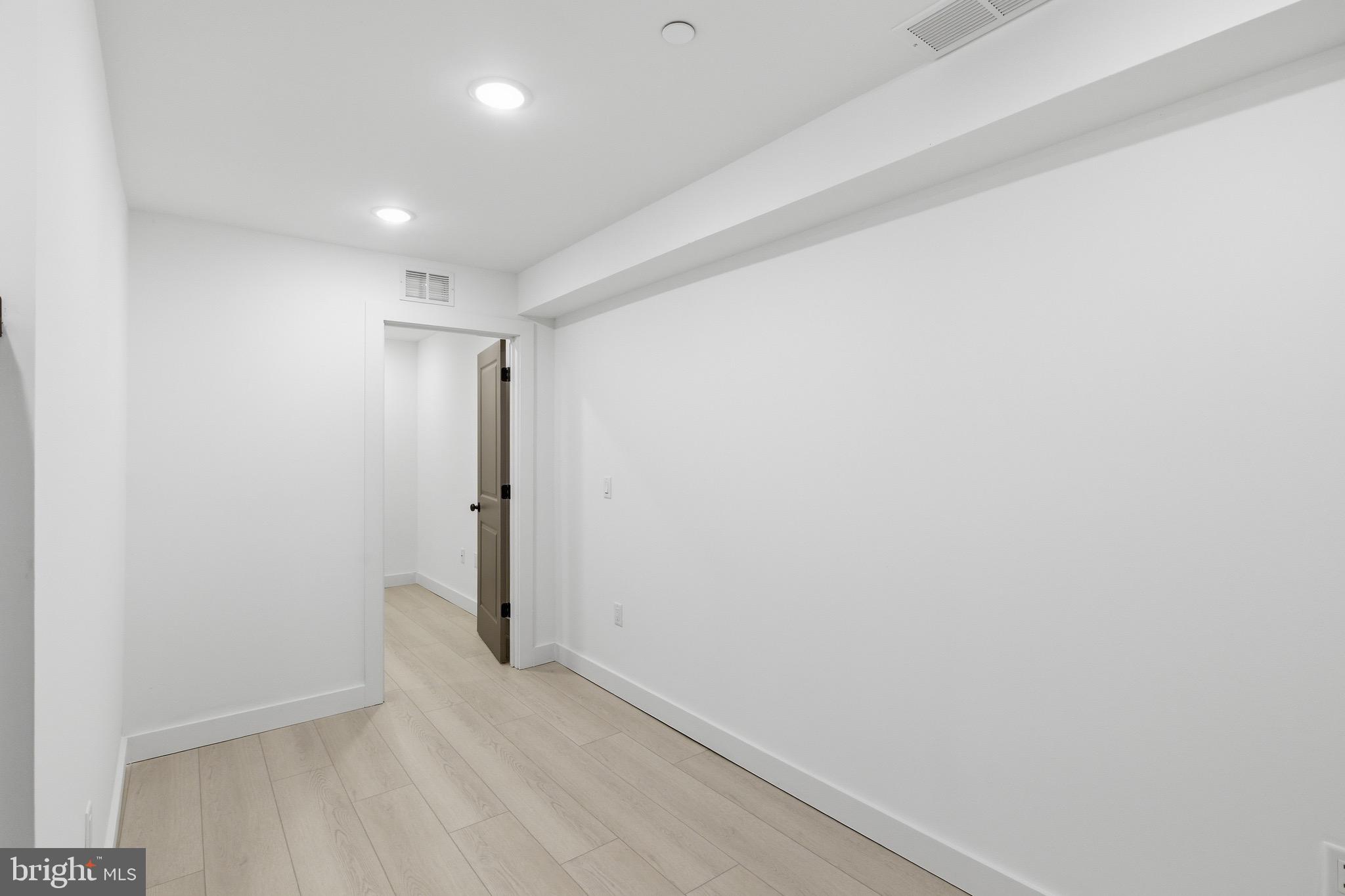 1005 West Orleans Street Philadelphia, PA 19133 - Photo 9 of 25 a view of hallway with wooden floor