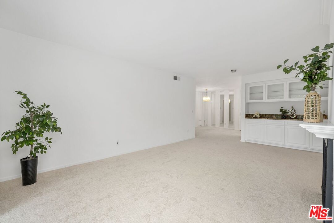 1211 Raintree Circle Culver City, CA 90230 - Photo 13 of 44 a view of kitchen with furniture and a potted plant