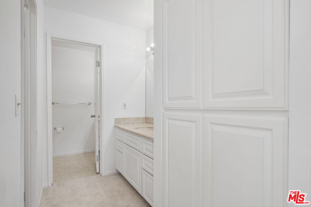 1211 Raintree Circle Culver City, CA 90230 - Photo 19 of 44 a bathroom with a shower