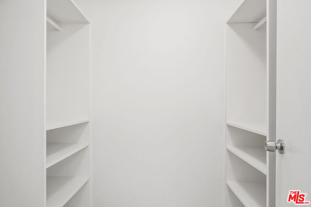 1211 Raintree Circle Culver City, CA 90230 - Photo 21 of 44 a view of an empty walk in closet