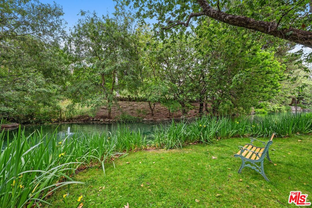 1211 Raintree Circle Culver City, CA 90230 - Photo 32 of 44 a view of a lake with a bench