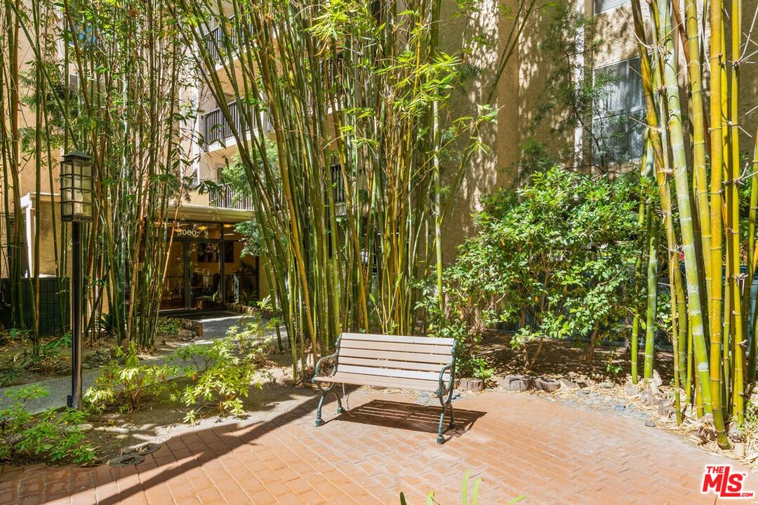 1211 Raintree Circle Culver City, CA 90230 - Photo 34 of 44 a bench sitting in front of a building