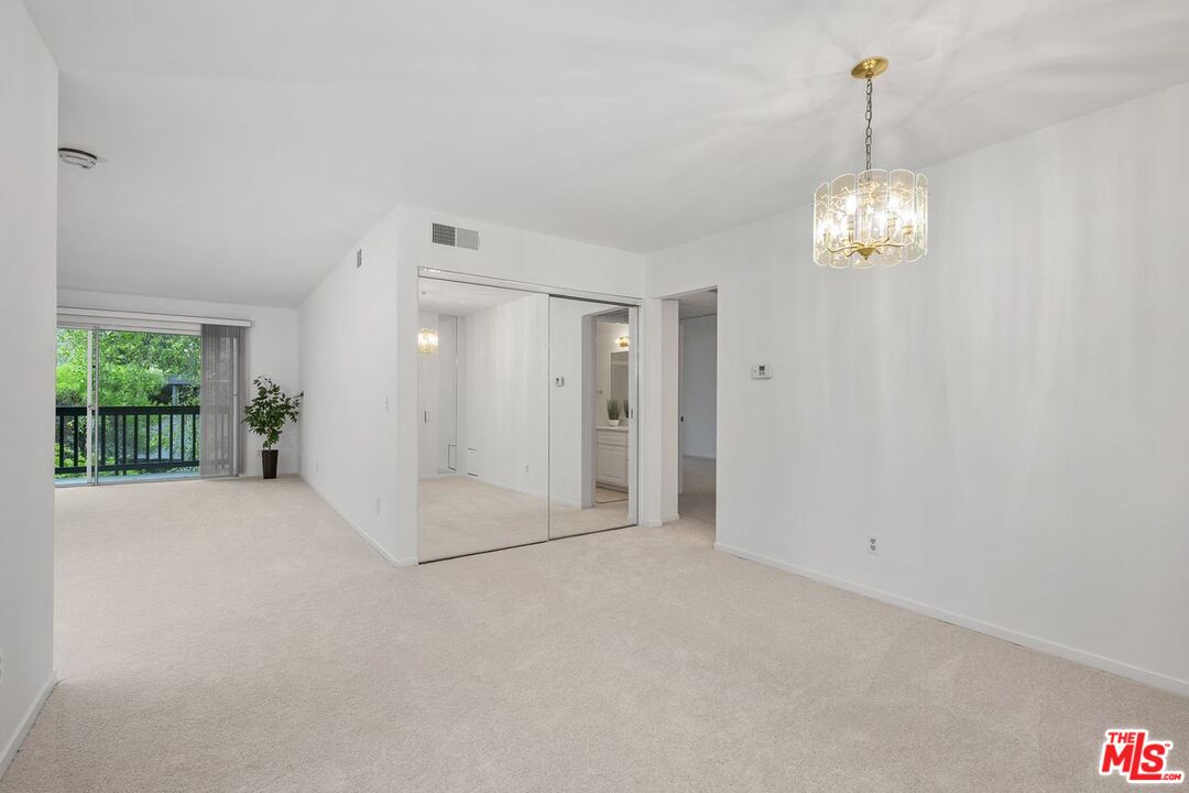 1211 Raintree Circle Culver City, CA 90230 - Photo 9 of 44 a view of a chandelier in big room and windows