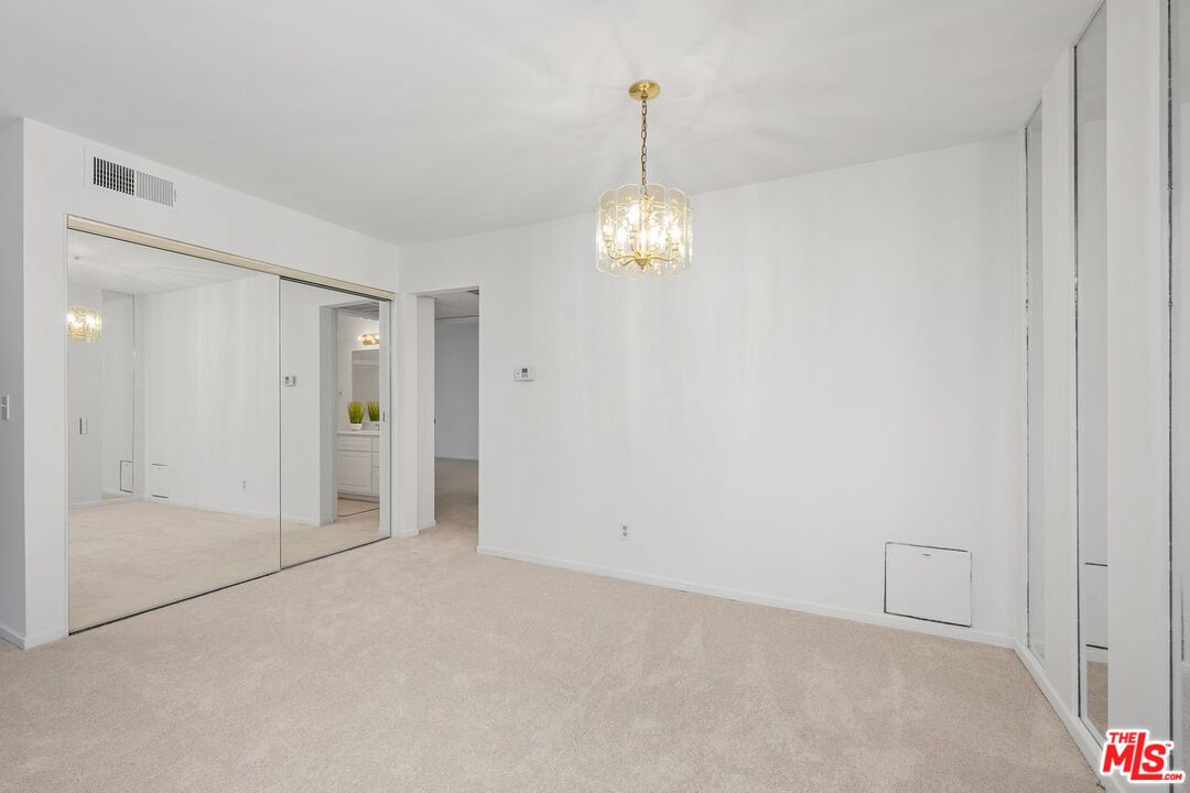1211 Raintree Circle Culver City, CA 90230 - Photo 10 of 44 a view of empty room with wooden floor