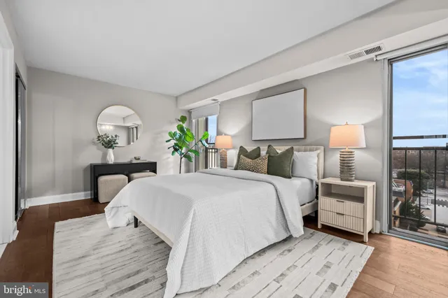 a bed room with a bed and a lamp