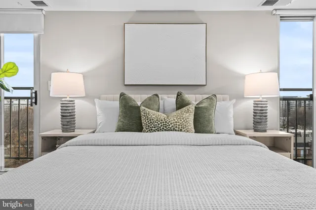 a bedroom with a bed and a lamp