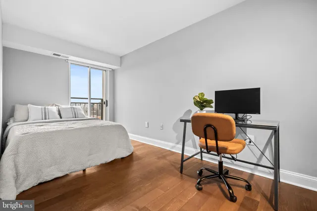 a workspace with furniture and wooden floor