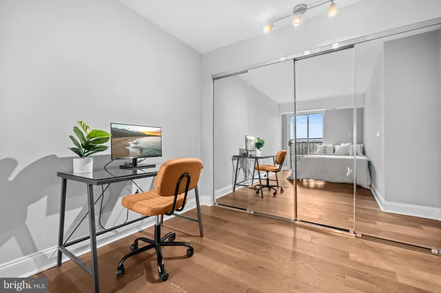 a view of a workspace with furniture and a couch