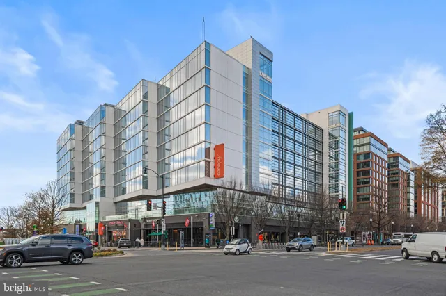 a city street lined with buildings and cars