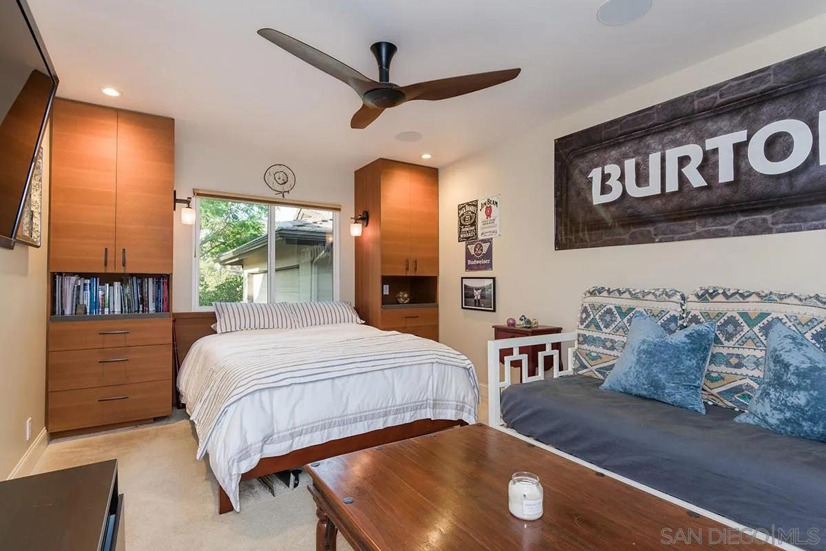 14316 High Valley Road Poway, CA 92064 - Photo 13 of 32 a bedroom with a bed and a large mirror