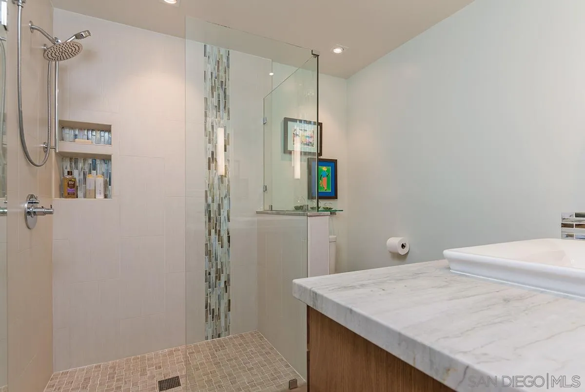 14316 High Valley Road Poway, CA 92064 - Photo 15 of 32 a bathroom with a sink a toilet and shower