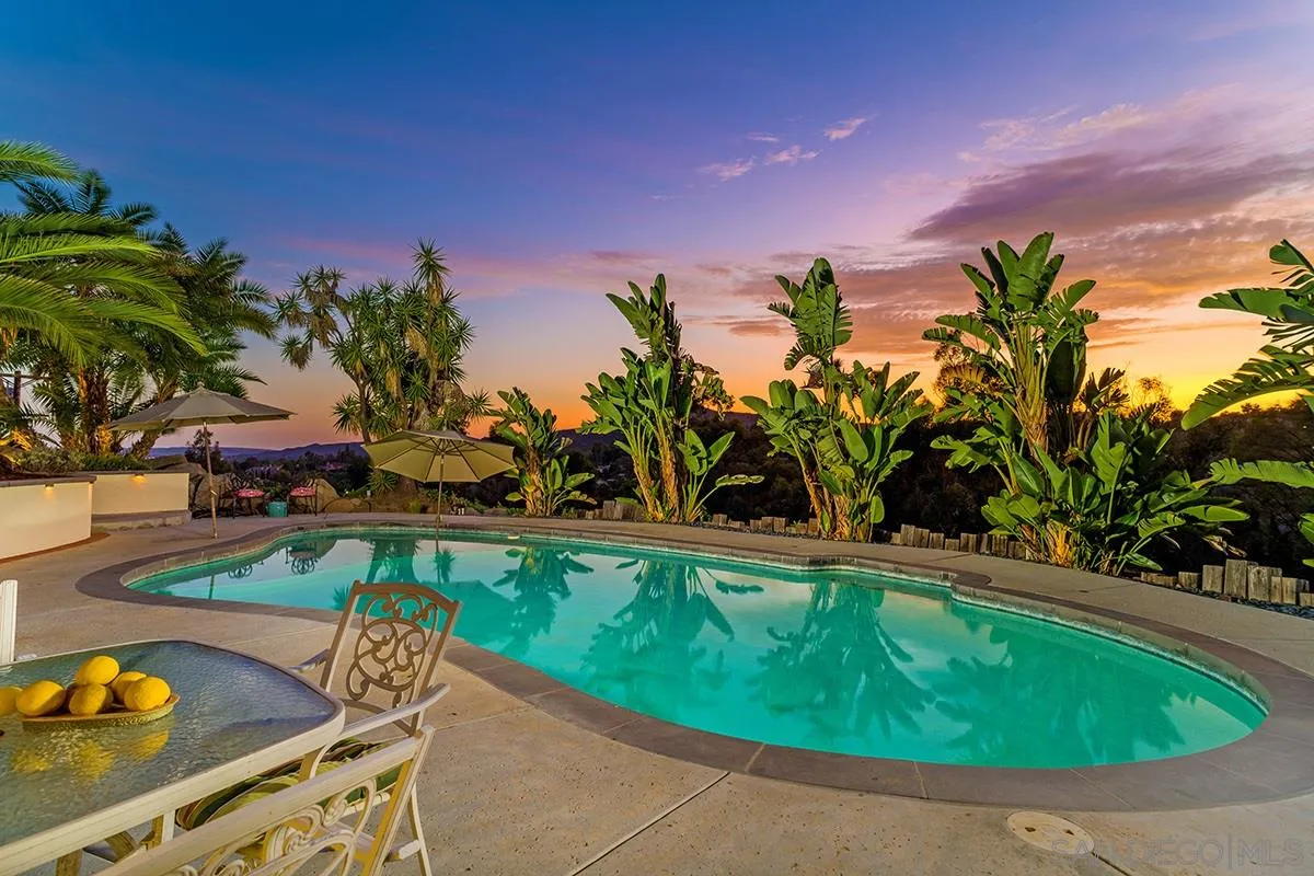14316 High Valley Road Poway, CA 92064 - Photo 18 of 32 a view of a swimming pool with an outdoor seating