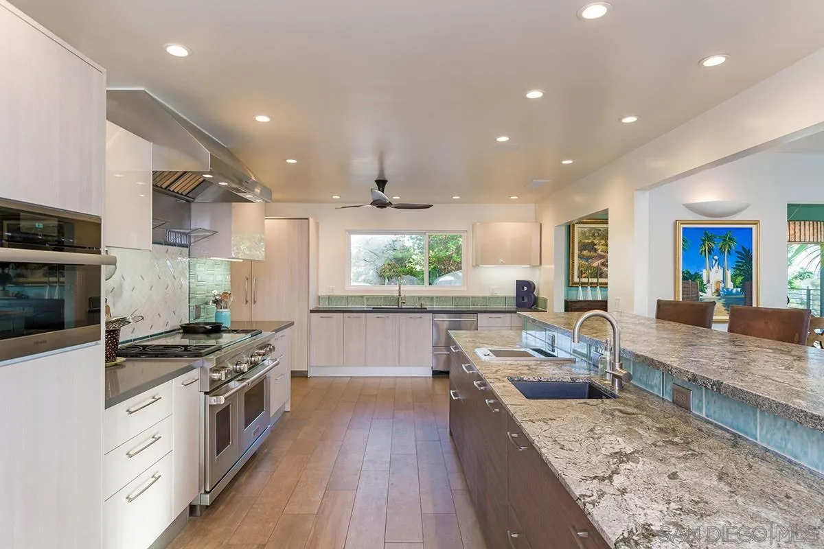 14316 High Valley Road Poway, CA 92064 - Photo 2 of 32 a large kitchen with stainless steel appliances granite countertop a large counter top a stove a sink and a refrigerator