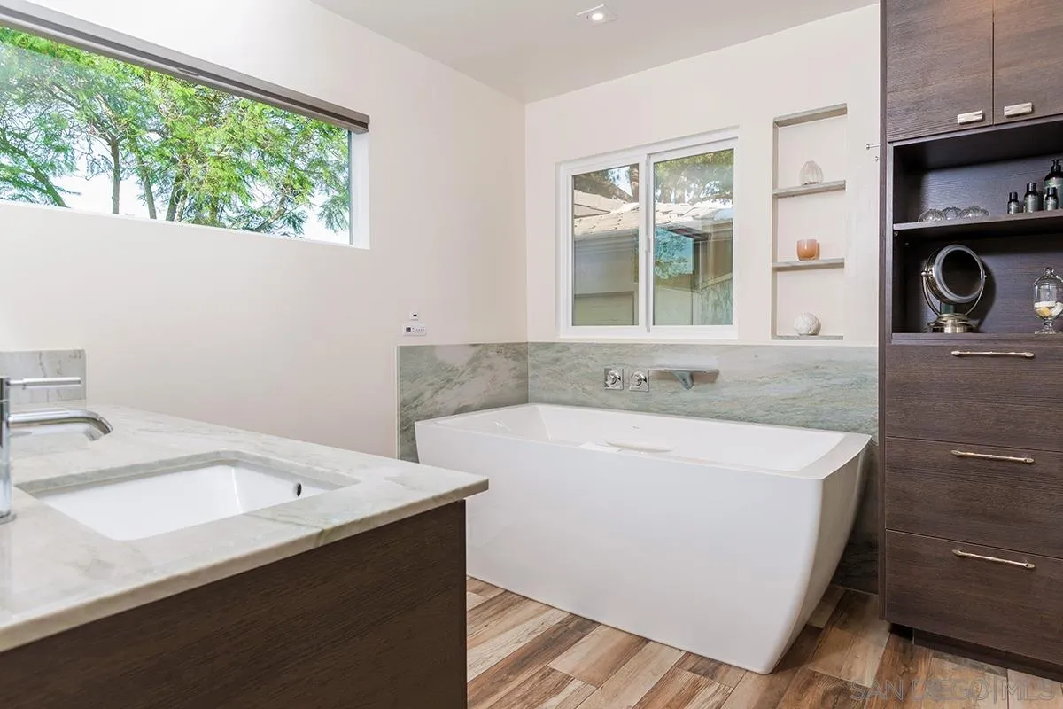 14316 High Valley Road Poway, CA 92064 - Photo 10 of 32 a bathroom with a tub sink and window