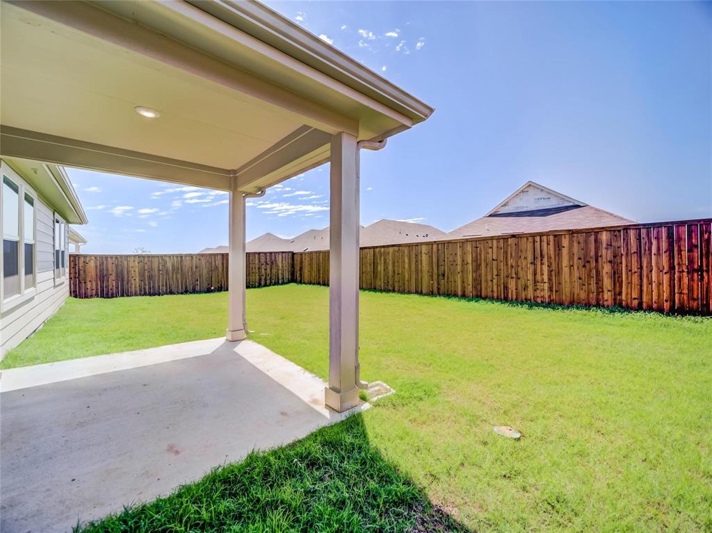 3405 Kingsgarden Road Denton, TX 76207 - Photo 25 of 37 a view of an house with backyard and tree