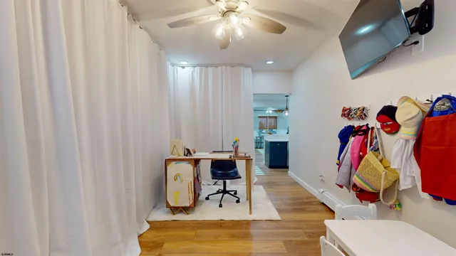 a bathroom with a sink and mirror with toilet