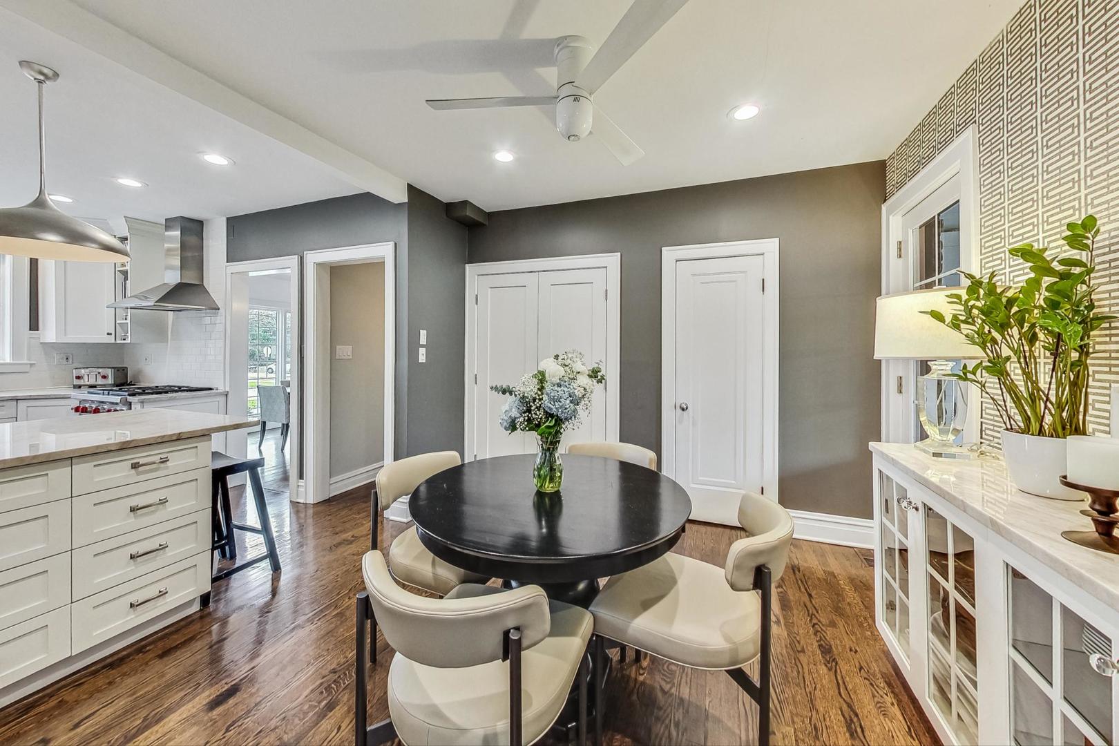 352 Addison Road Riverside, IL 60546 - Photo 16 of 63 a kitchen with a table and chairs