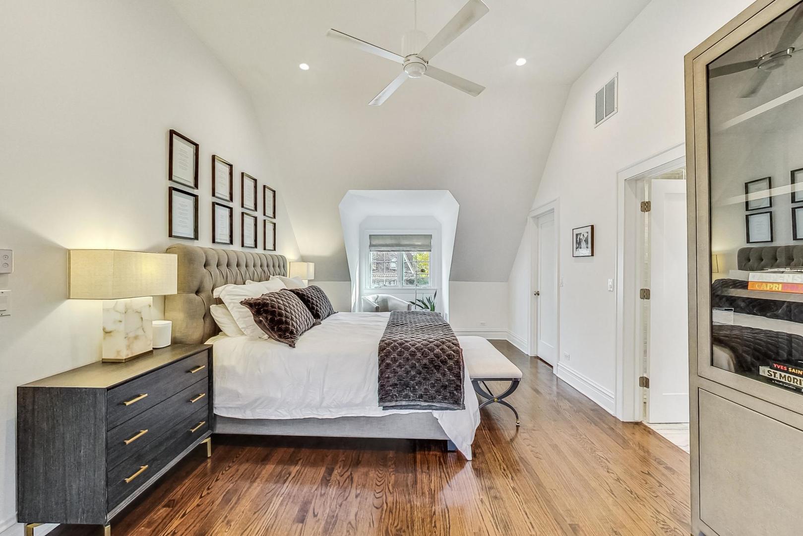 352 Addison Road Riverside, IL 60546 - Photo 28 of 63 a bedroom with a bed and wooden floor