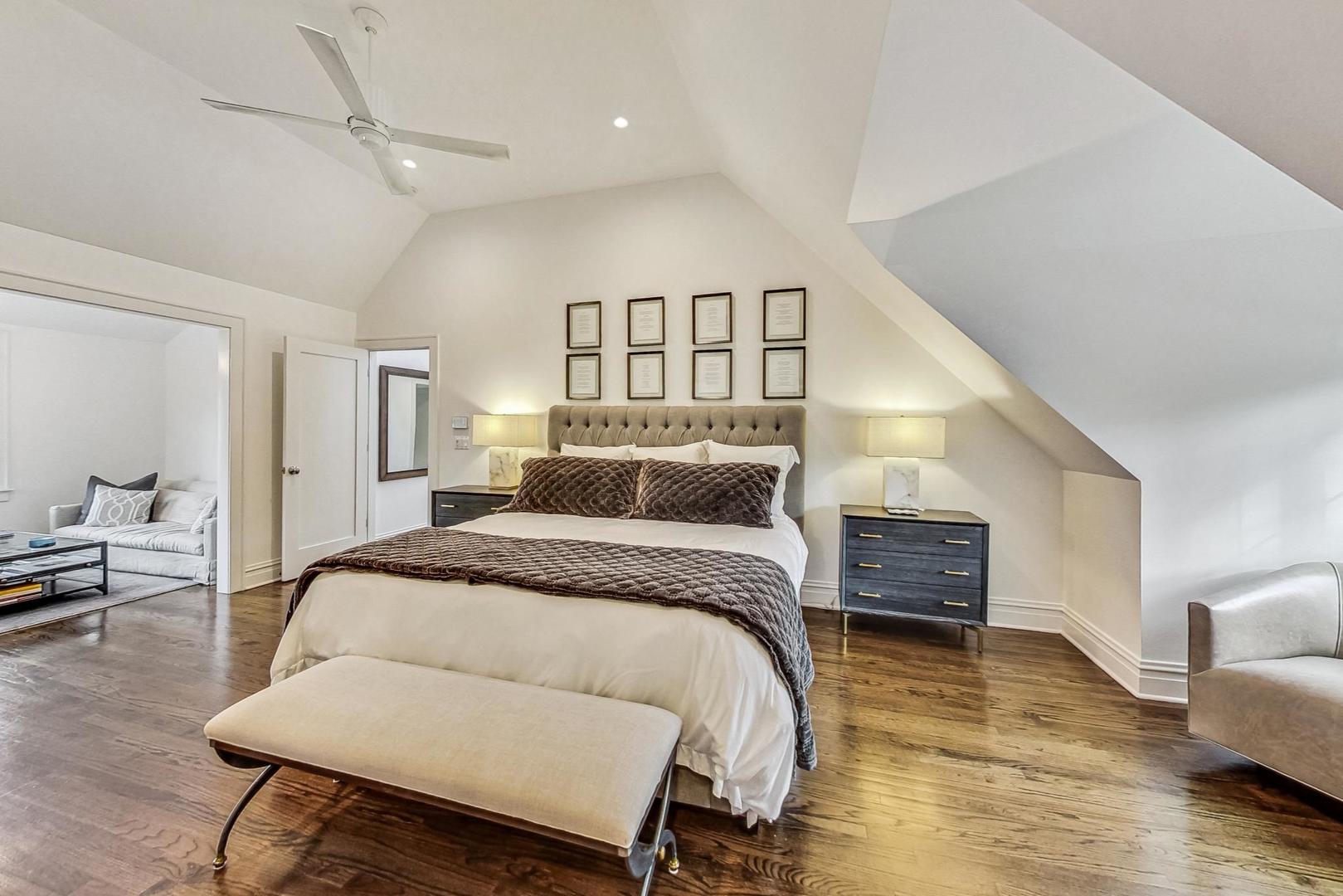 352 Addison Road Riverside, IL 60546 - Photo 29 of 63 a spacious bedroom with a bed a couch and dresser
