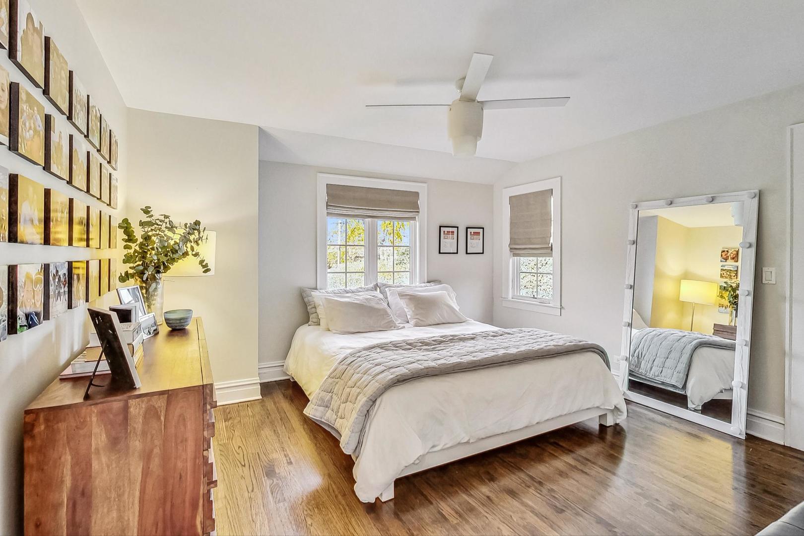 352 Addison Road Riverside, IL 60546 - Photo 35 of 63 a bedroom with a bed and wooden floor