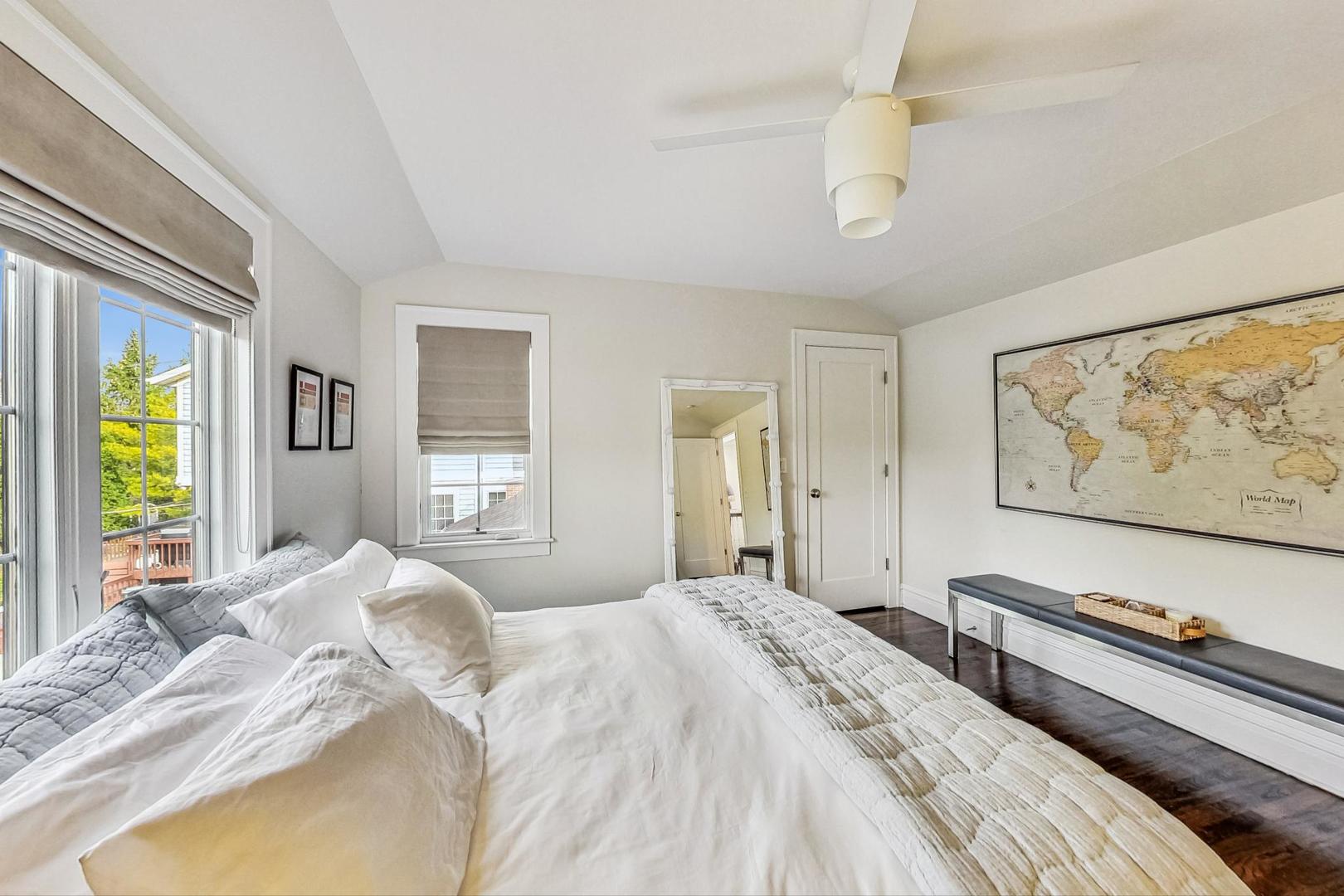 352 Addison Road Riverside, IL 60546 - Photo 36 of 63 a bedroom with a bed and a large window with the outer view