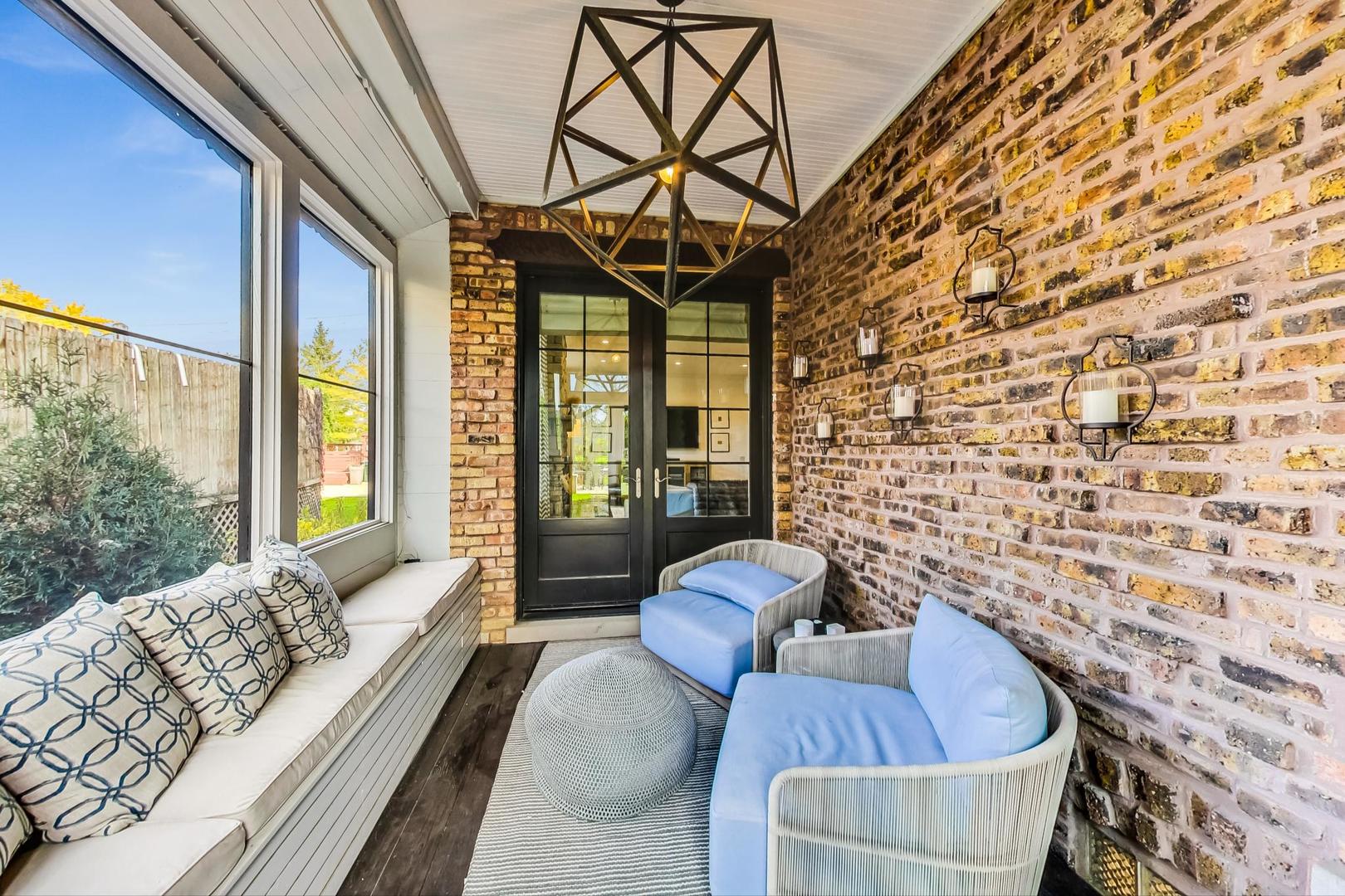 352 Addison Road Riverside, IL 60546 - Photo 54 of 63 a living room with furniture and a floor to ceiling window