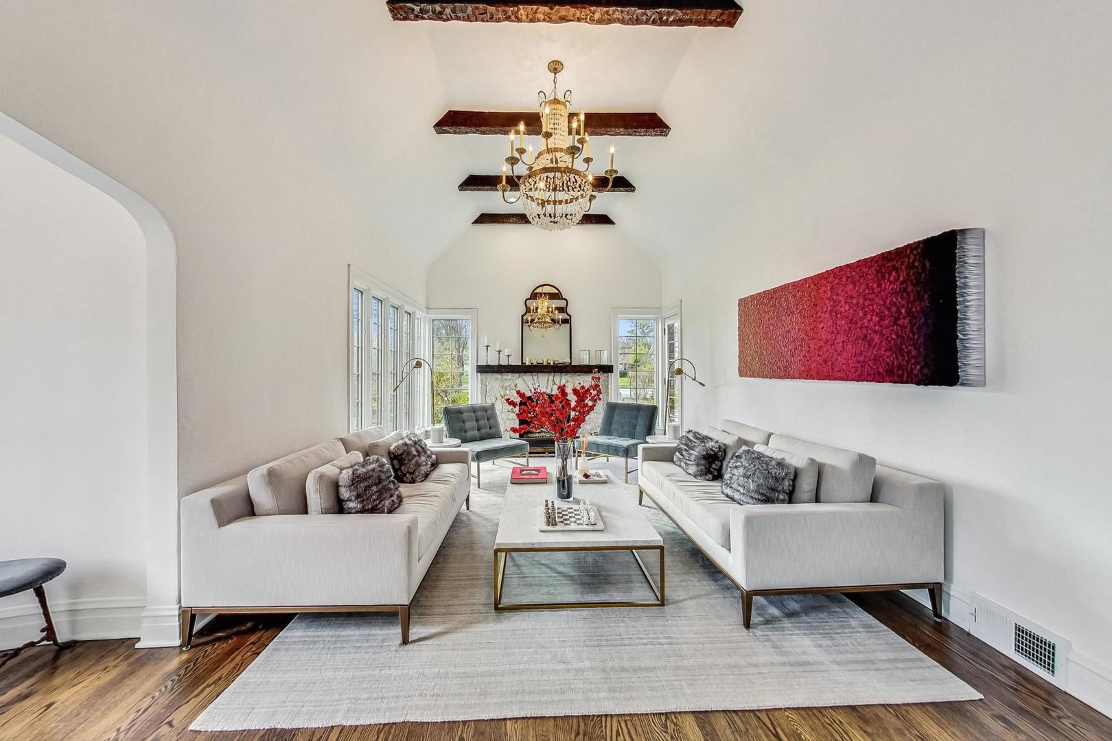 352 Addison Road Riverside, IL 60546 - Photo 6 of 63 a living room with furniture and a chandelier