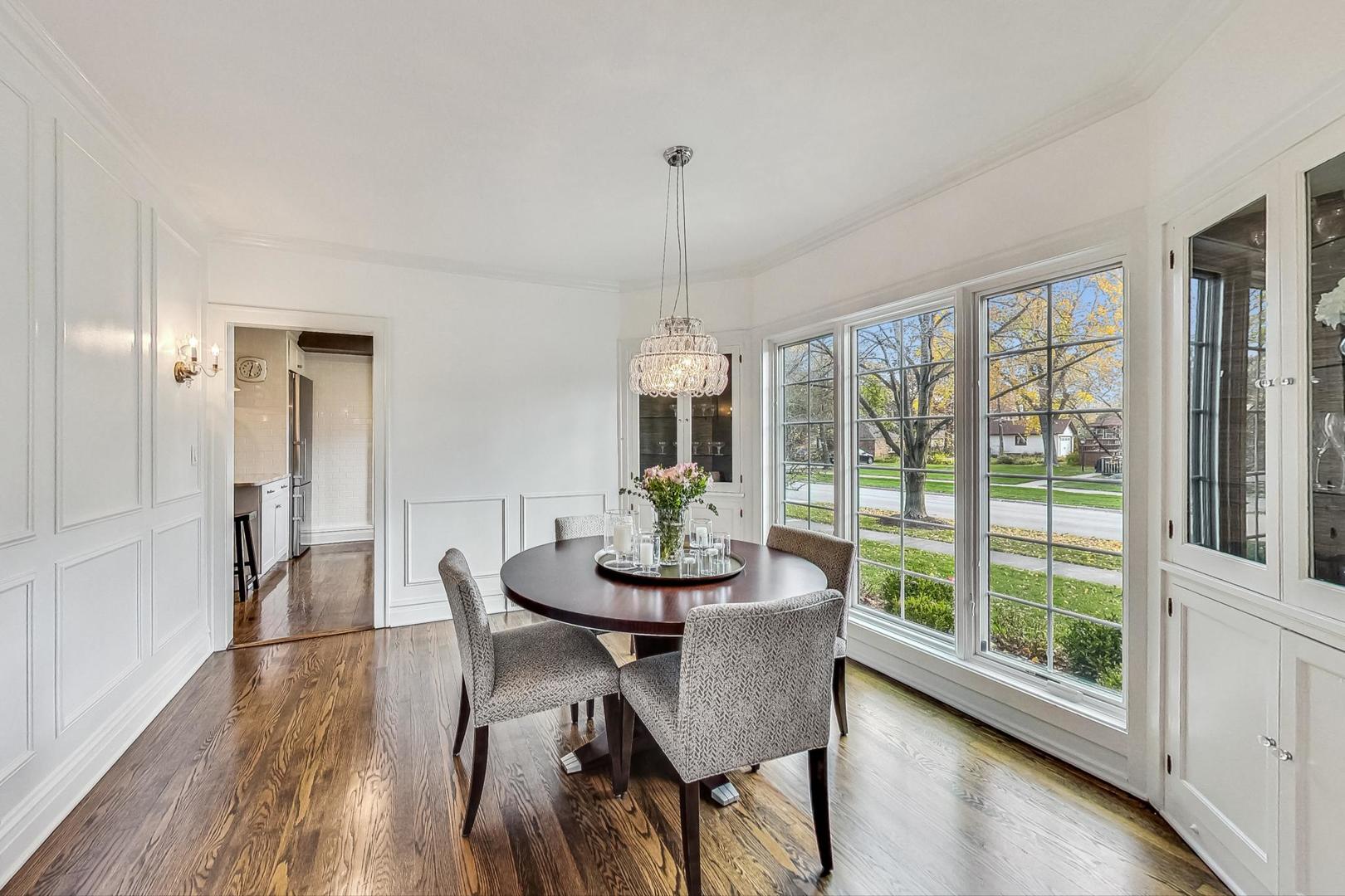 352 Addison Road Riverside, IL 60546 - Photo 9 of 63 a dining room with furniture window wooden floor