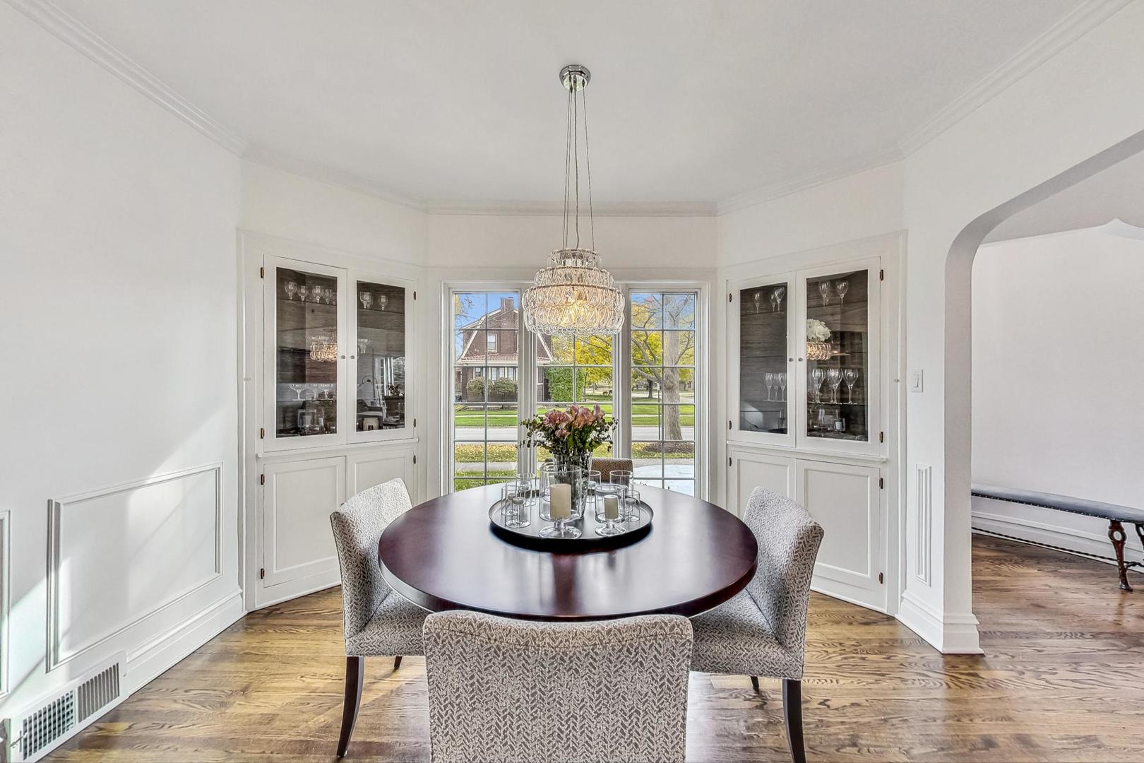 352 Addison Road Riverside, IL 60546 - Photo 10 of 63 a dining room with furniture a chandelier and wooden floor