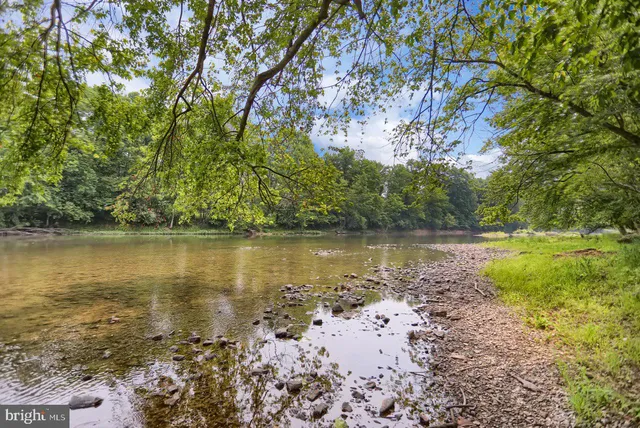 a view of a lake with a yard