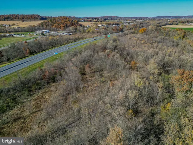 a view of a yard with a wooden deck