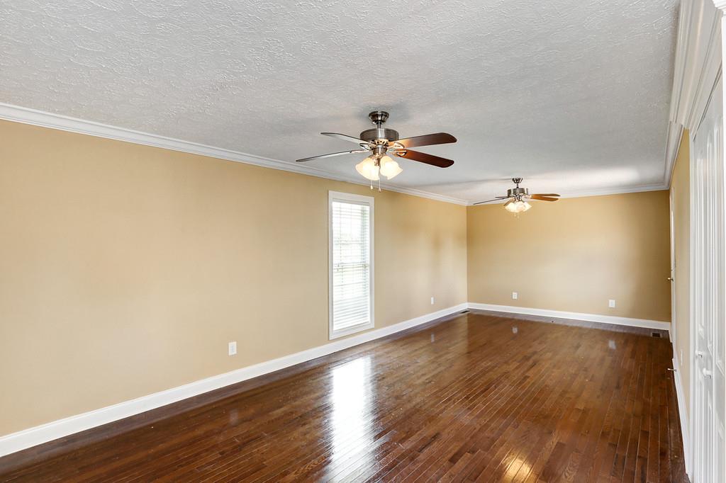 29920 State Line Road Ardmore, AL 35739 - Photo 14 of 25 Dual Ceiling Fans, Crown Molding Textured Ceilings, More New Hardwood