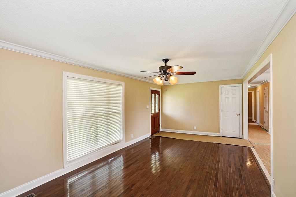 29920 State Line Road Ardmore, AL 35739 - Photo 5 of 25 Living Room, Ceiling Fan, New Oak Hardwood, Crown Molding, New Windows