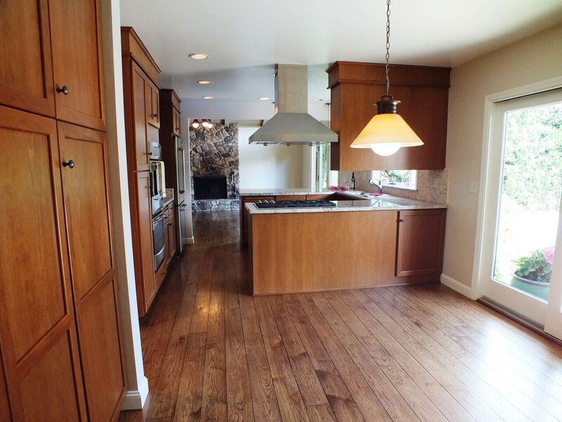 202 Rio Verde Drive Salinas, CA 93901 - Photo 11 of 35 a kitchen with stainless steel appliances granite countertop a refrigerator a stove a sink and a wooden floor