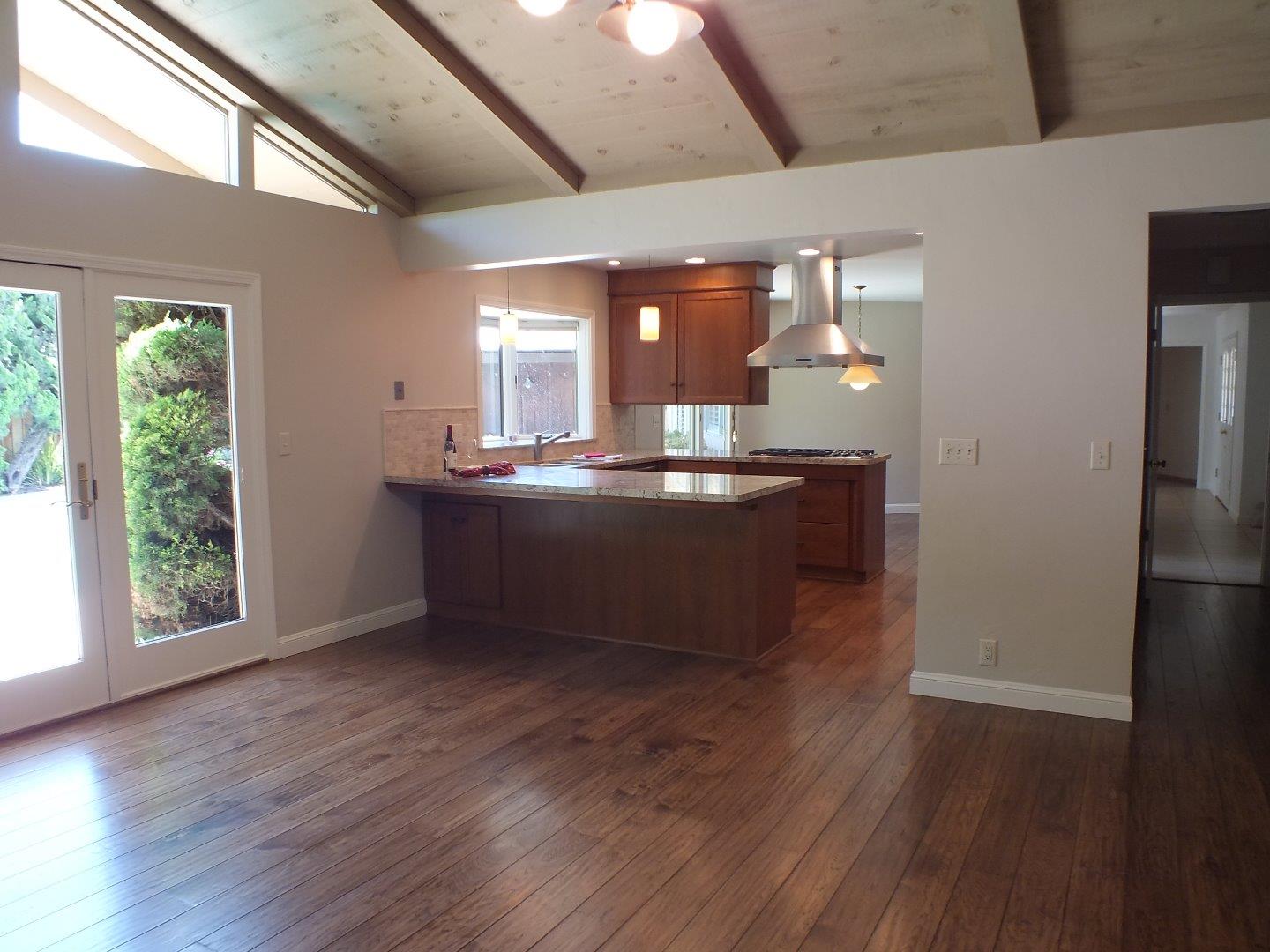202 Rio Verde Drive Salinas, CA 93901 - Photo 12 of 35 a kitchen with kitchen island a sink appliances and a large window