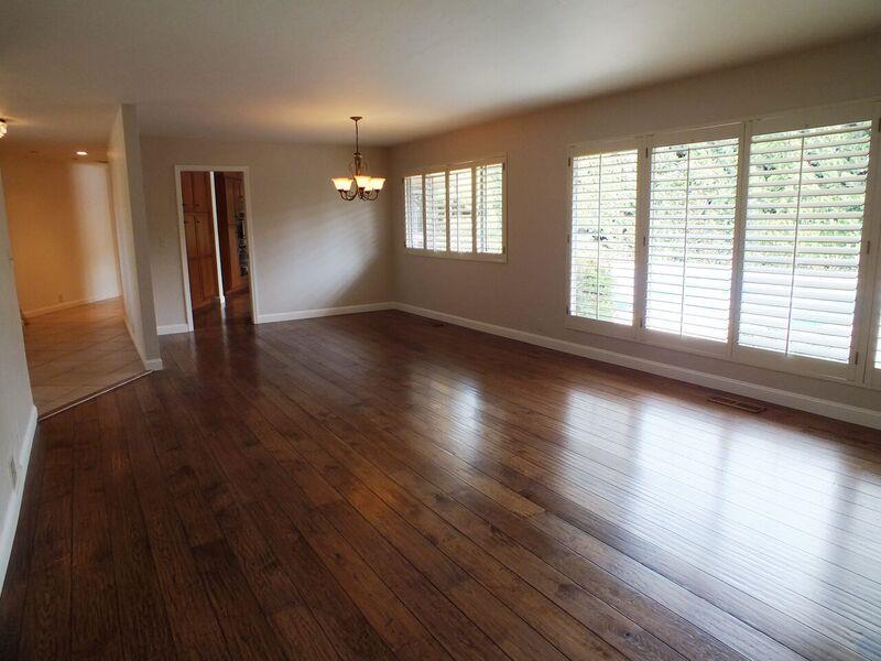 202 Rio Verde Drive Salinas, CA 93901 - Photo 15 of 35 an empty room with wooden floor and windows