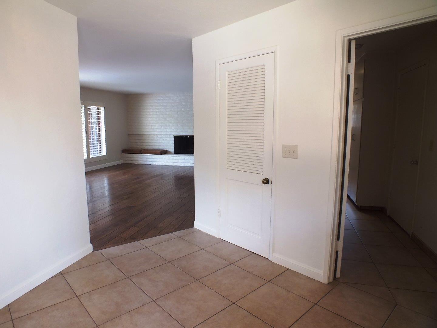 202 Rio Verde Drive Salinas, CA 93901 - Photo 16 of 35 a view of a hallway to an empty room with wooden floor