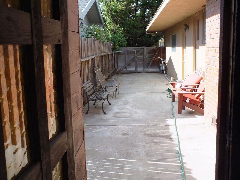 202 Rio Verde Drive Salinas, CA 93901 - Photo 34 of 35 a view of a patio with table and chairs with wooden floor and fence