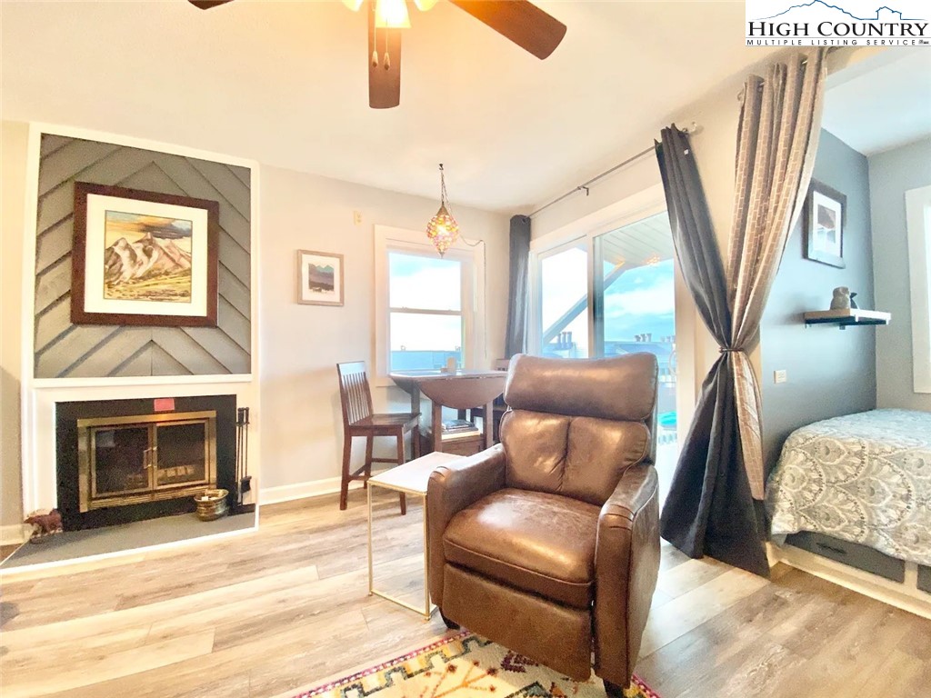 a bedroom with furniture and a fireplace