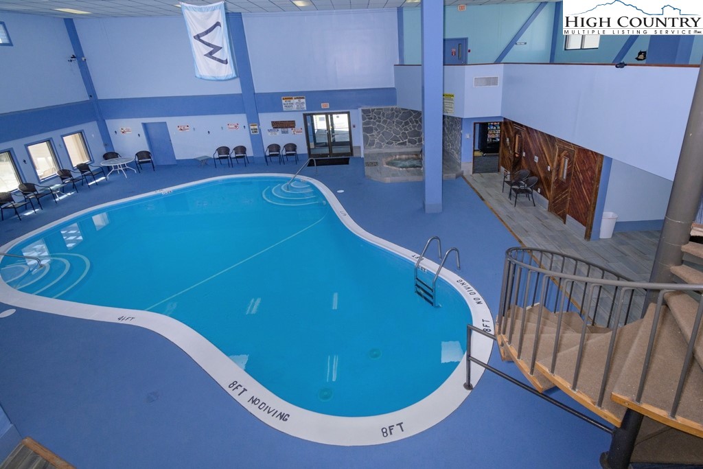 301 Pinnacle Inn Road, Unit 1302 Beech Mountain, NC 28604 - Photo 29 of 33 a view of a swimming pool with seating area