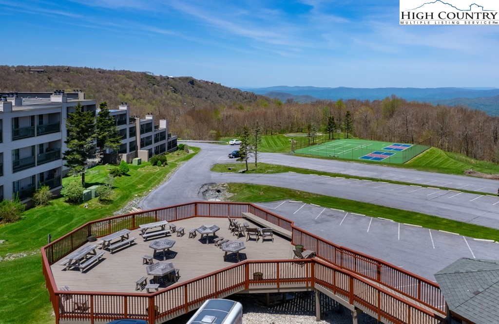 301 Pinnacle Inn Road, Unit 1302 Beech Mountain, NC 28604 - Photo 31 of 33 a view of a chairs and table on the terrace
