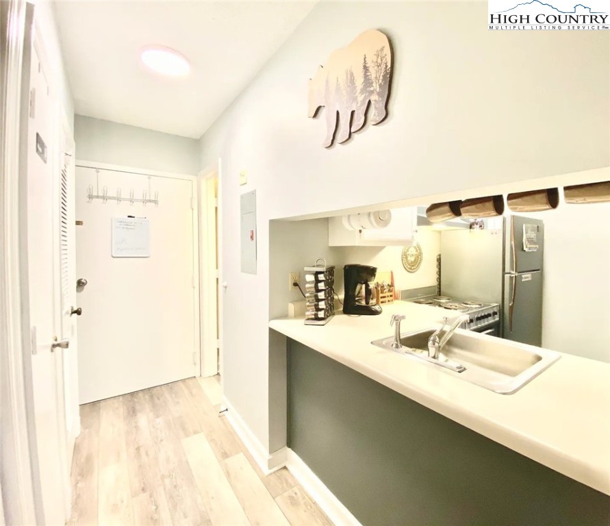 301 Pinnacle Inn Road, Unit 1302 Beech Mountain, NC 28604 - Photo 6 of 33 a bathroom with a sink and a mirror