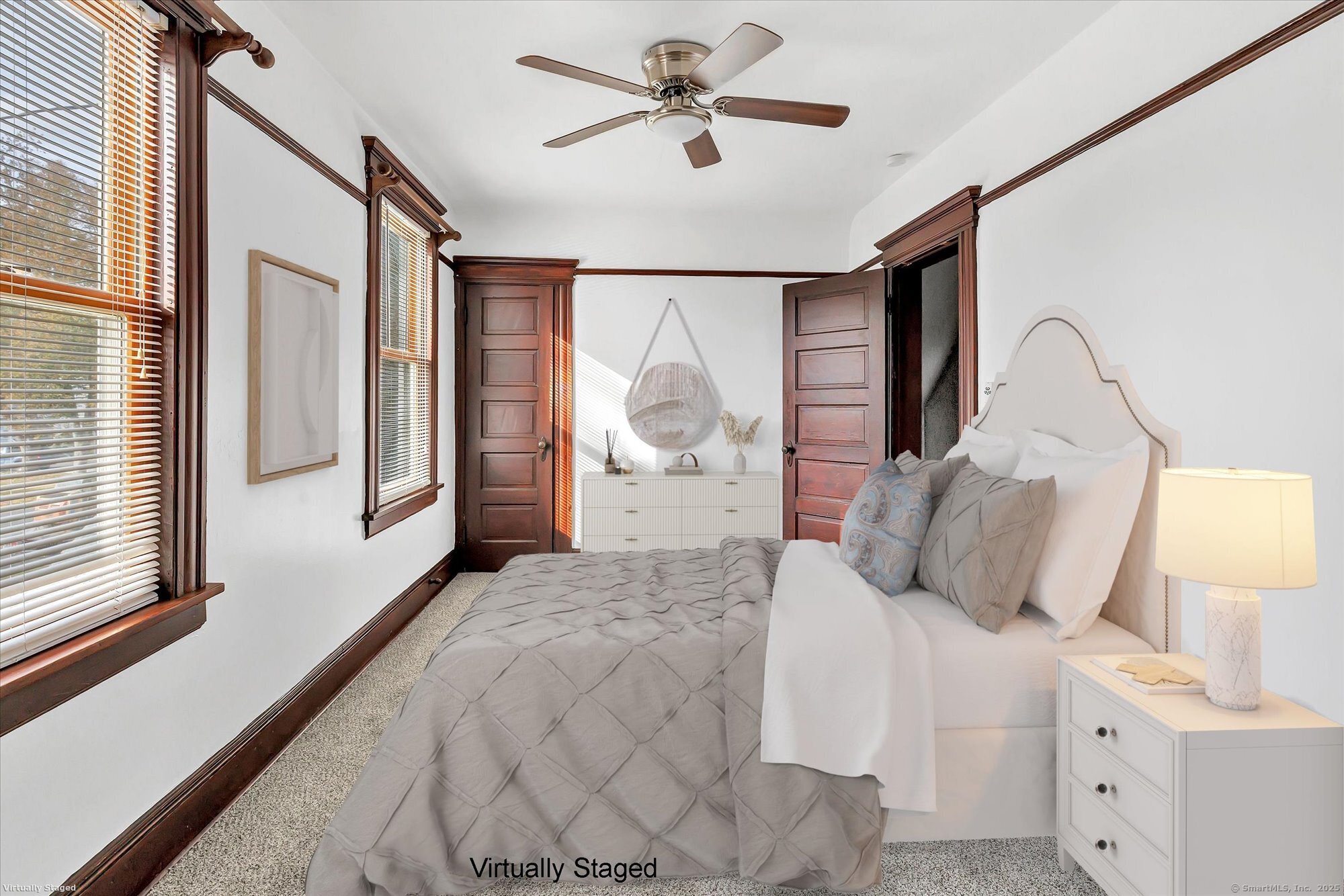 1250 Huntington Road Stratford, CT 06614 - Photo 25 of 39 a bedroom with a large bed and a chandelier