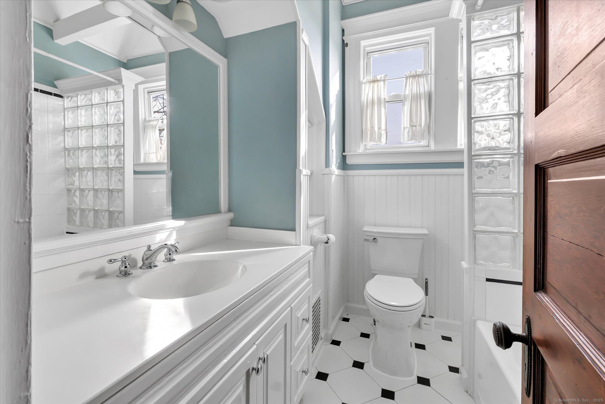 1250 Huntington Road Stratford, CT 06614 - Photo 31 of 39 a bathroom with a sink a toilet and a window