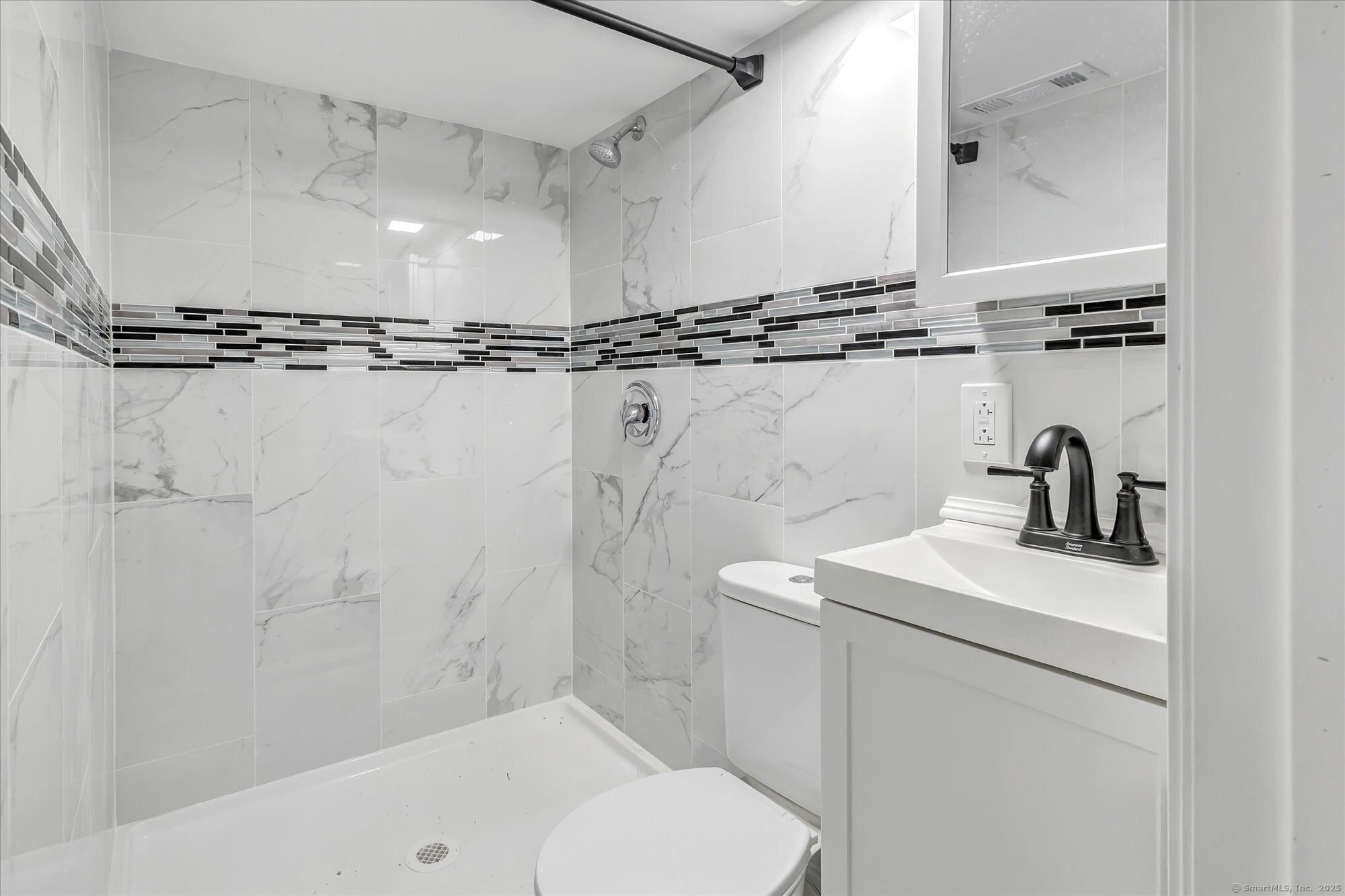 1250 Huntington Road Stratford, CT 06614 - Photo 36 of 39 a bathroom with a sink a toilet and shower