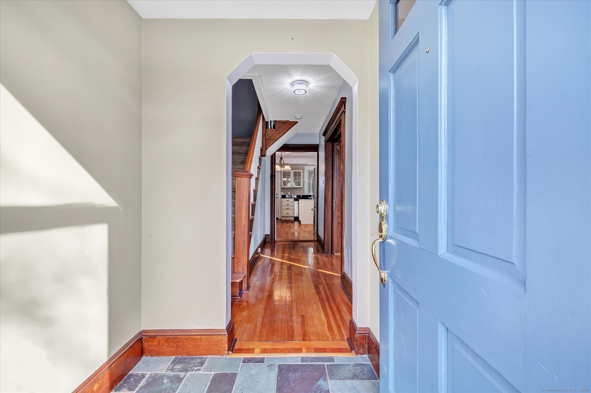 1250 Huntington Road Stratford, CT 06614 - Photo 6 of 39 a view of a living room with a bed and wooden floor